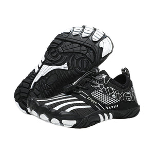 Black Alpine Teens barefoot shoes pair, one sole up, with lightweight, breathable, foot-strengthening icons